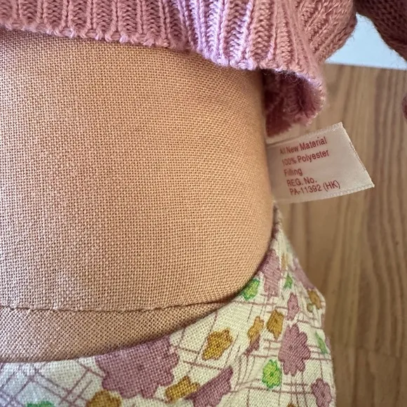 American Girl Doll in Pink Cardigan and Floral Skirt