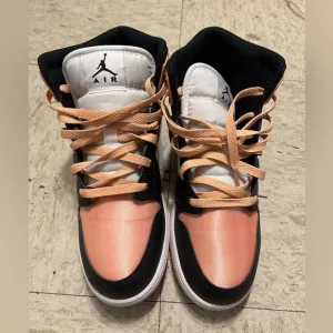 Black, white and peach high top shoes