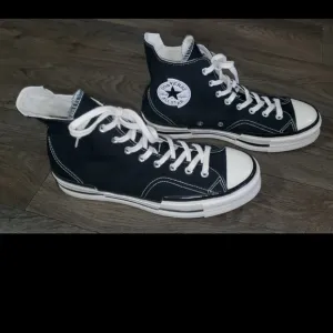 Converse Chuck 70 Plus Black and White High-Top Sneakers