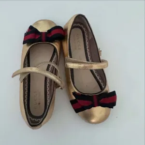 Gucci Gold Kids Shoes with Red and Black Bow