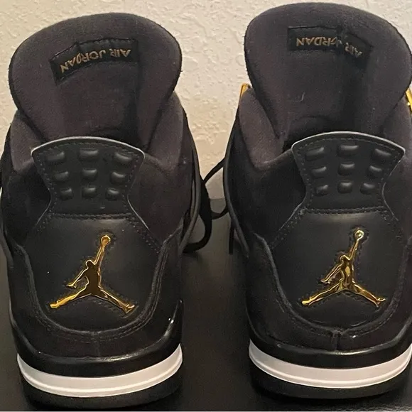 Jordan Black and Gold Athletic Shoes with Iconic Design