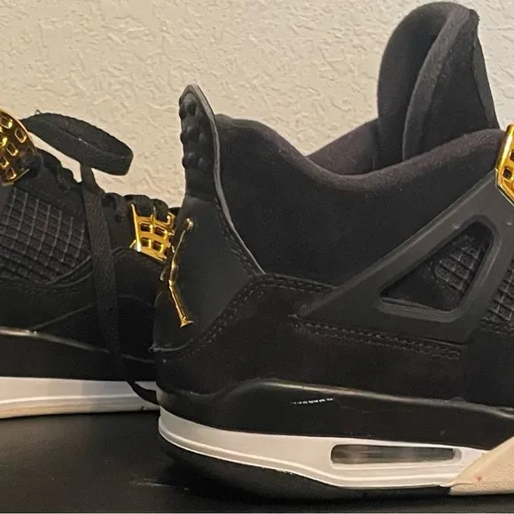 Jordan Black and Gold Athletic Shoes with Iconic Design