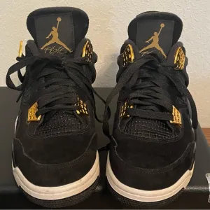Jordan Black and Gold Athletic Shoes with Iconic Design