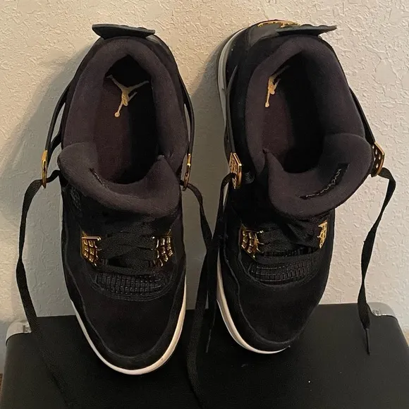 Jordan Black and Gold Athletic Shoes with Iconic Design