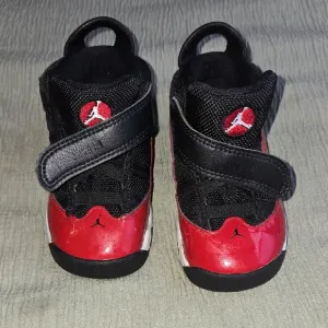 Kids Red and Black Nike Shoes
