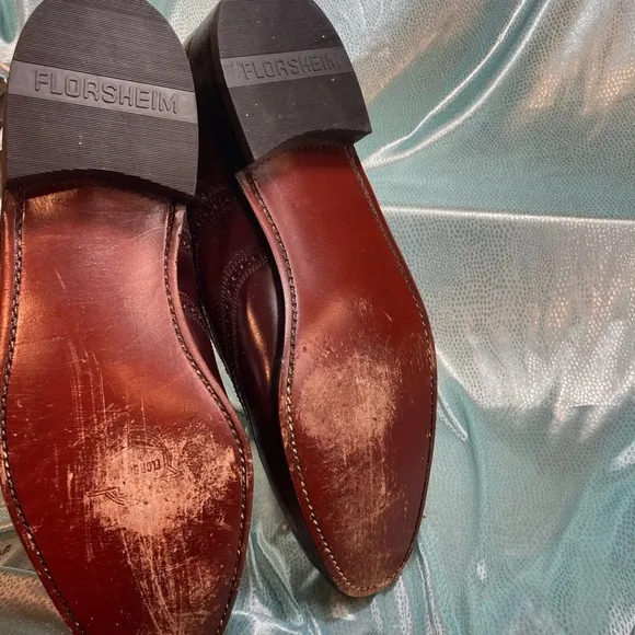 Maroon Florsheim wingtip leather shoes. Size 9D.