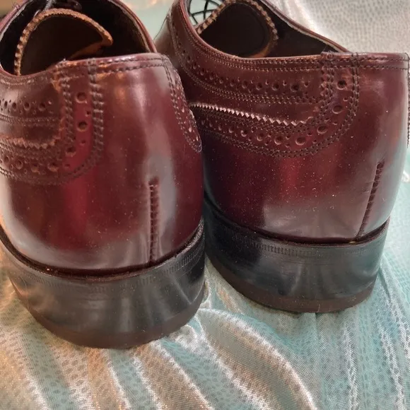 Maroon Florsheim wingtip leather shoes. Size 9D.