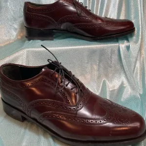 Maroon Florsheim wingtip leather shoes. Size 9D.