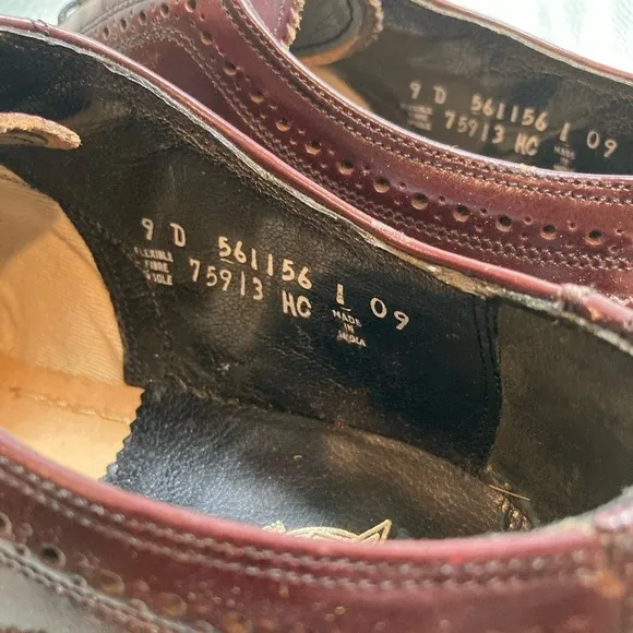 Maroon Florsheim wingtip leather shoes. Size 9D.