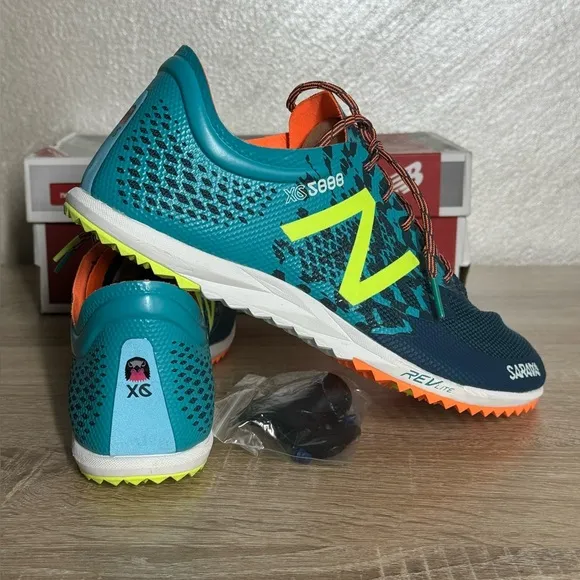 New Balance Women 12 Teal and Neon Yellow Running Shoes Spikes Sneakers