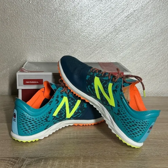 New Balance Women 12 Teal and Neon Yellow Running Shoes Spikes Sneakers
