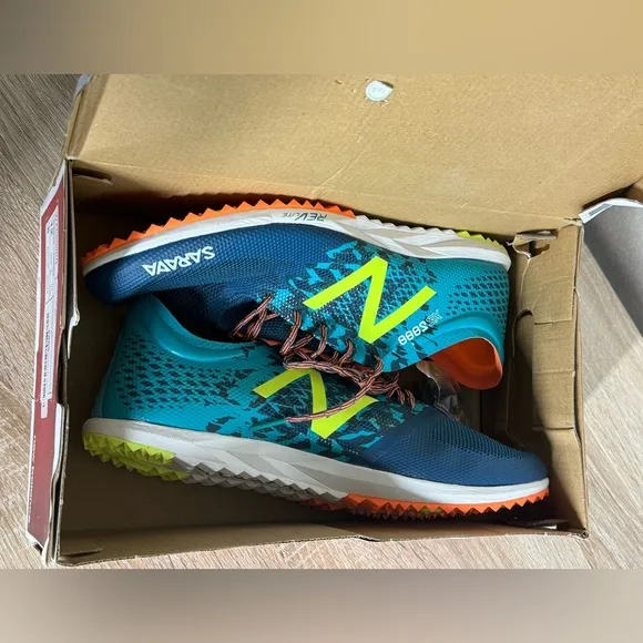 New Balance Women 12 Teal and Neon Yellow Running Shoes Spikes Sneakers