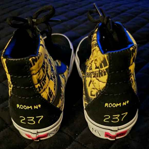 Vans Black and Yellow High-Top Sneakers with Bold Accents
