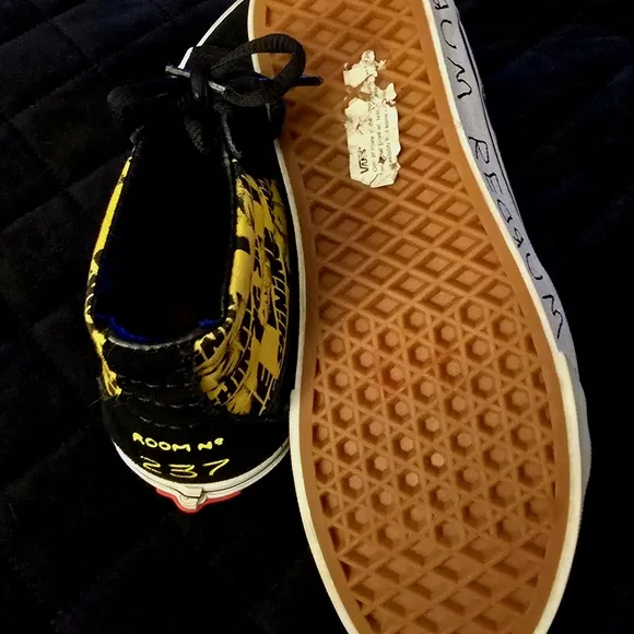 Vans Black and Yellow High-Top Sneakers with Bold Accents