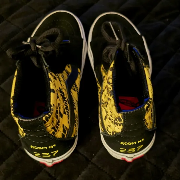 Vans Black and Yellow High-Top Sneakers with Bold Accents